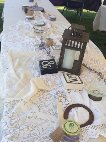 The tables were adorned with lace, doilies, lanterns, and unique knick knacks. The tablecloths were set at random angles on purpose to give the space a rustic look. 