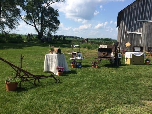 Outside the ceremony & dance barn space were personal items like photos, a sleigh, dressers, flowers, and other things from the family farm. 