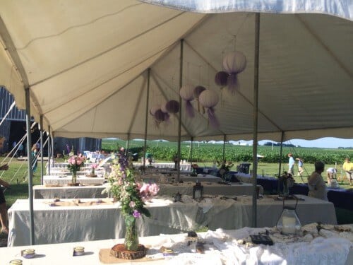 The dinner tent was decorated with lanterns, florals, lace, dollies, candles, and more. 