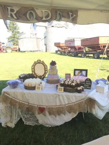 The dessert table was decorated with burlap pennants, wood chargers, picture frames, and adorable labels. Cake by Take the Cake Cupcakes. 