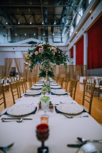 centerpieces and gold chairs