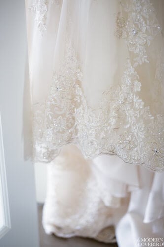 Wedding dress lace hem. Photo credit: The Modern Lovebird