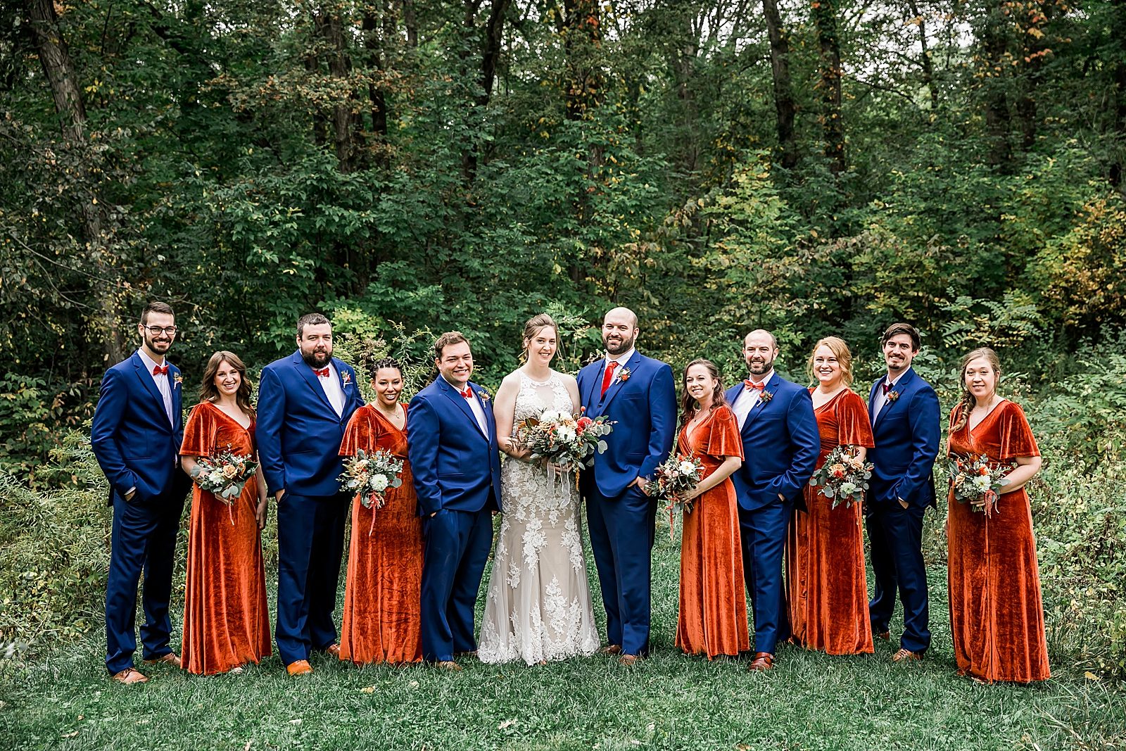 orange and blue wedding party in park