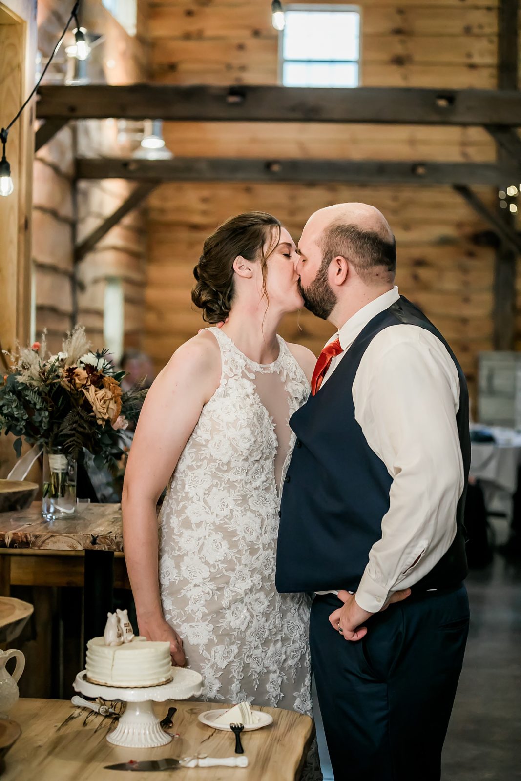 bride and groom kiss at reception