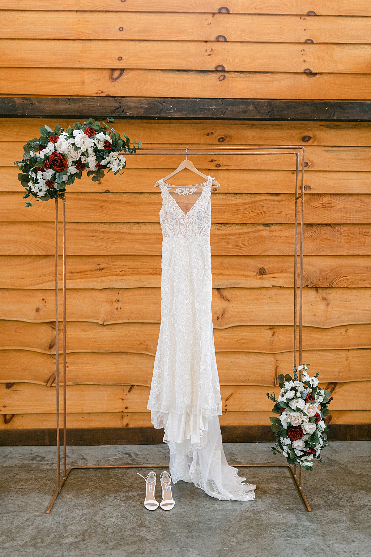 wedding dress hanging up before ceremony
