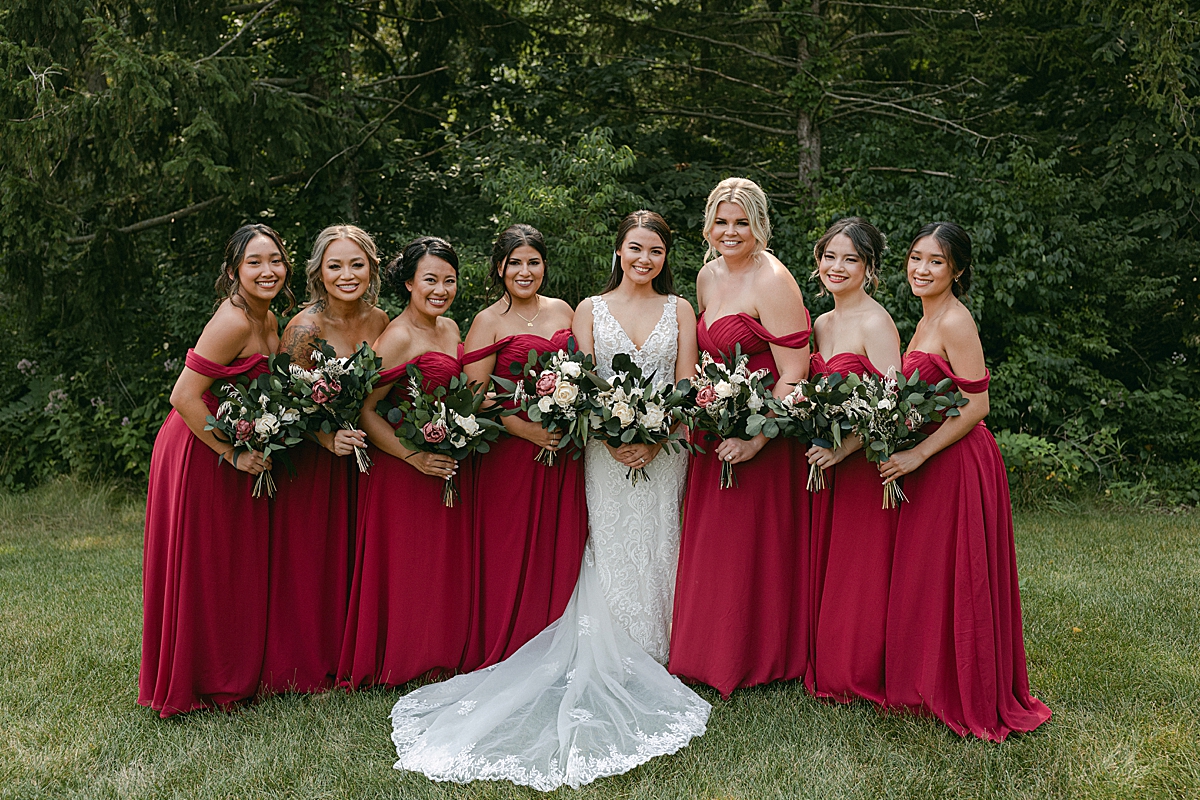 bride with bridesmaids in red dresses