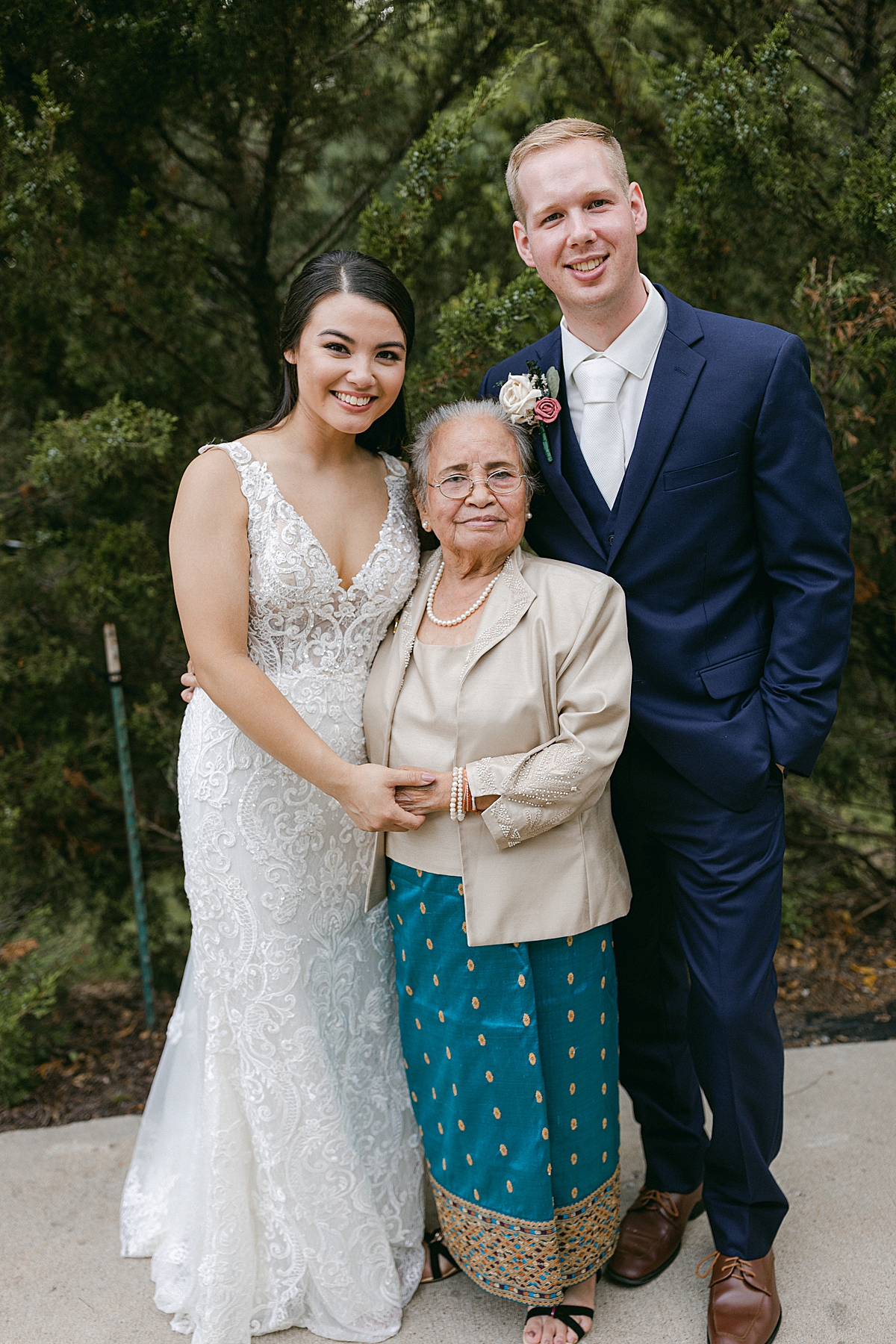 grandmother with bride and groom portrait