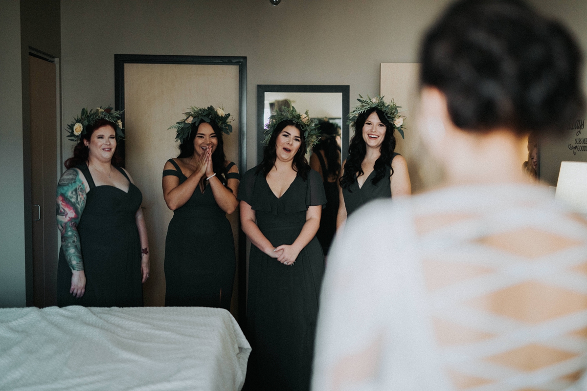 bridesmaids excited during first look with bride