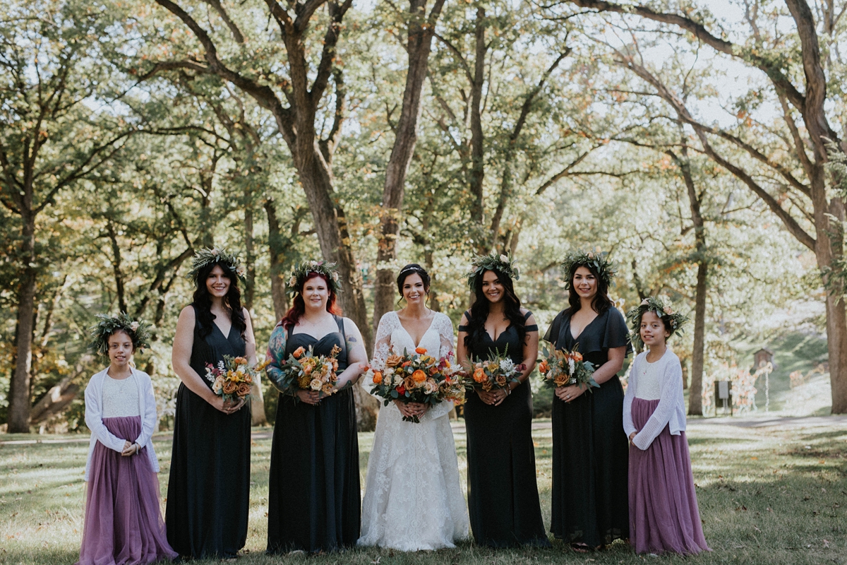 bride with bridesmaids and twin flower girls