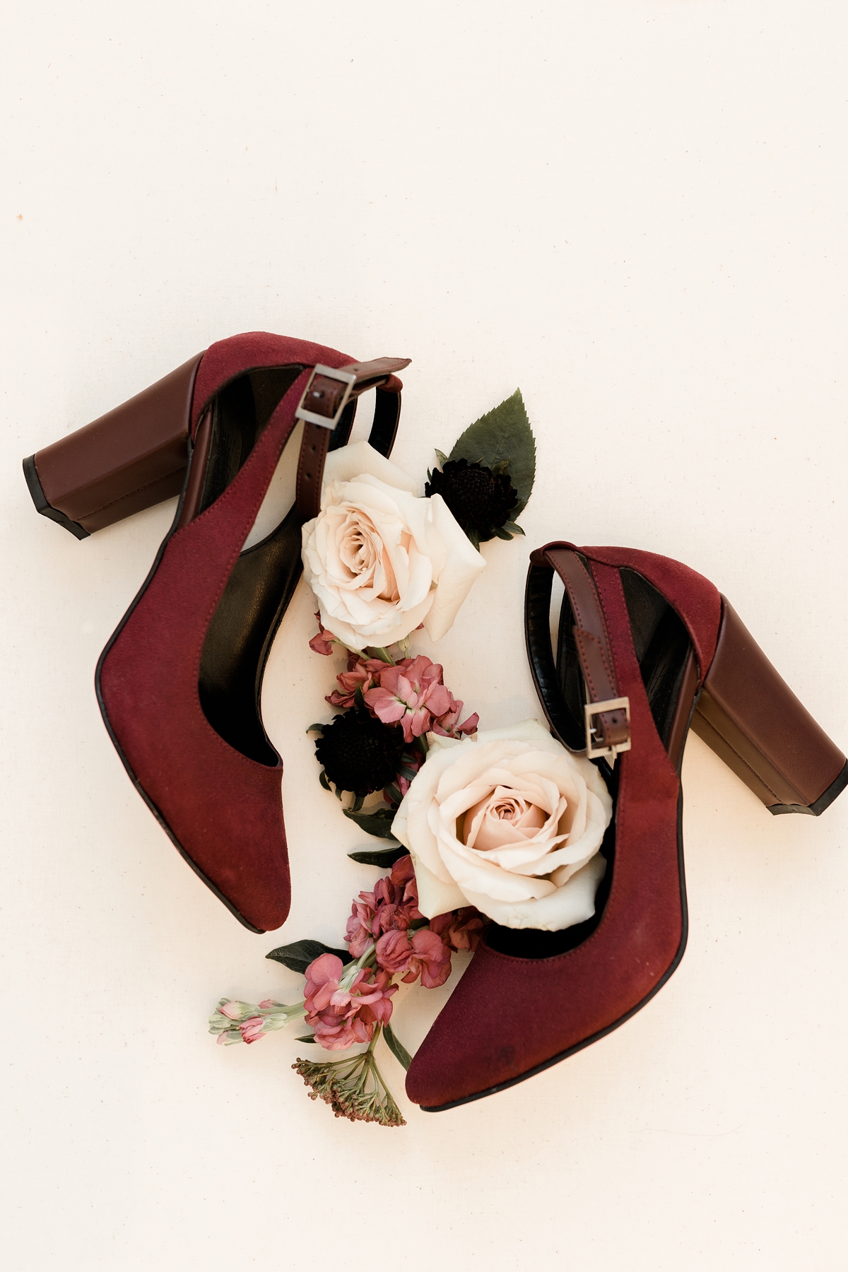bride's maroon red high heels floral wedding flat lay with roses
