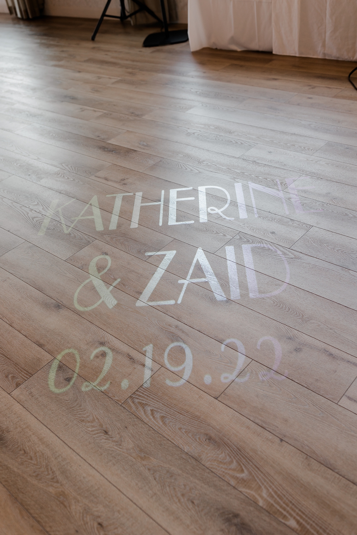 wedding reception bride and groom's names projected on floor