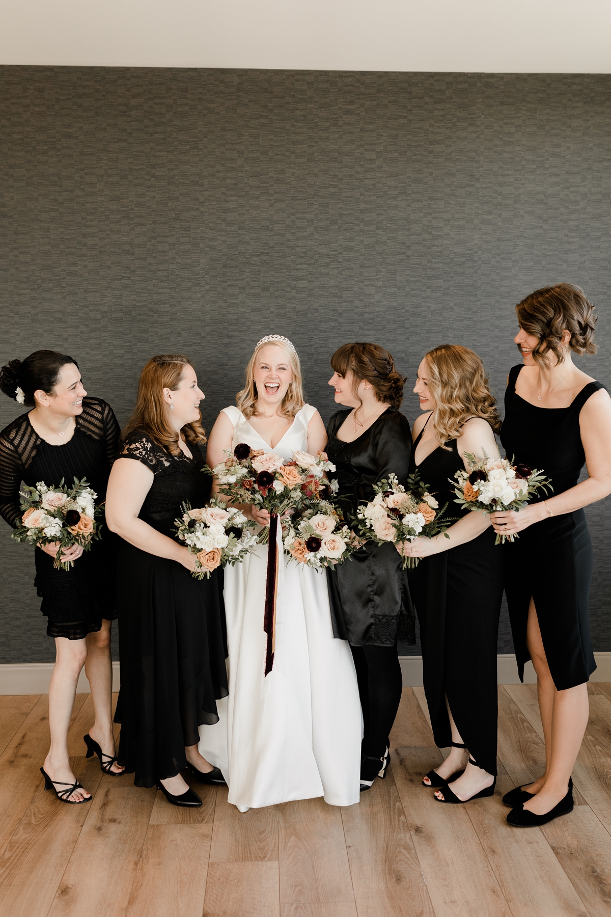 bride with bridesmaids in black mismatched dresses