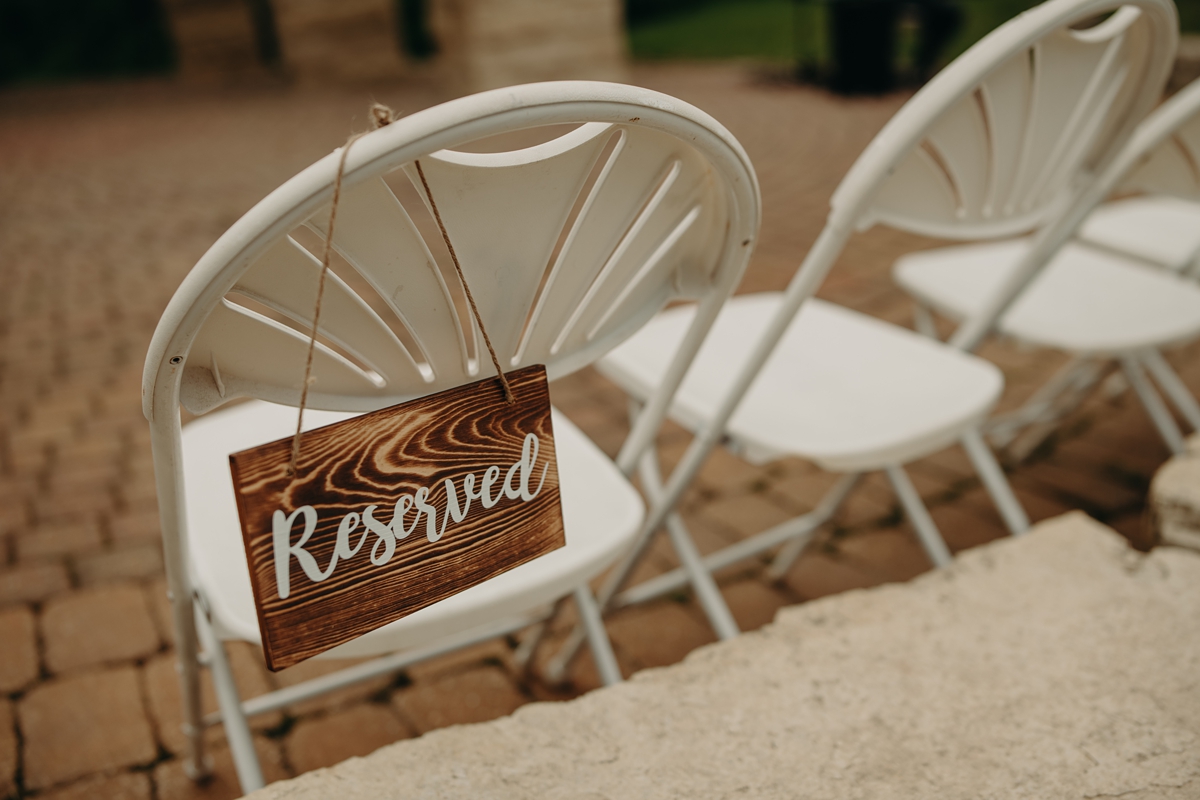Custom wooden reserved seat sign at wedding ceremony - Celebration Farm, Iowa City