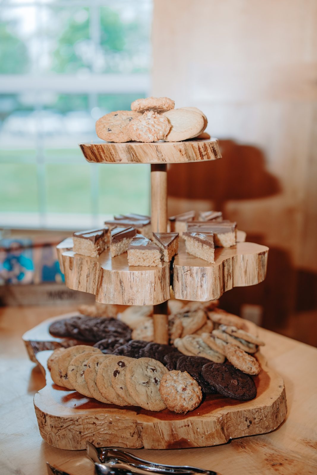 Rustic wooden dessert tower at Celebration Farm Wedding Reception Iowa City