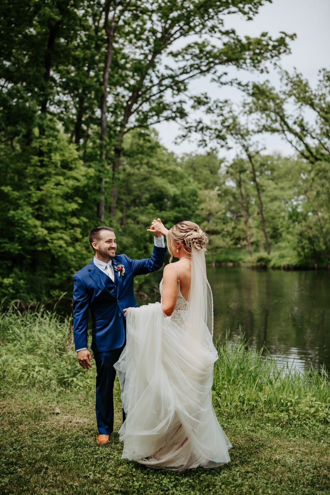 bride and groom dancing at edge of woods at Celebration Farm Wedding Iowa City