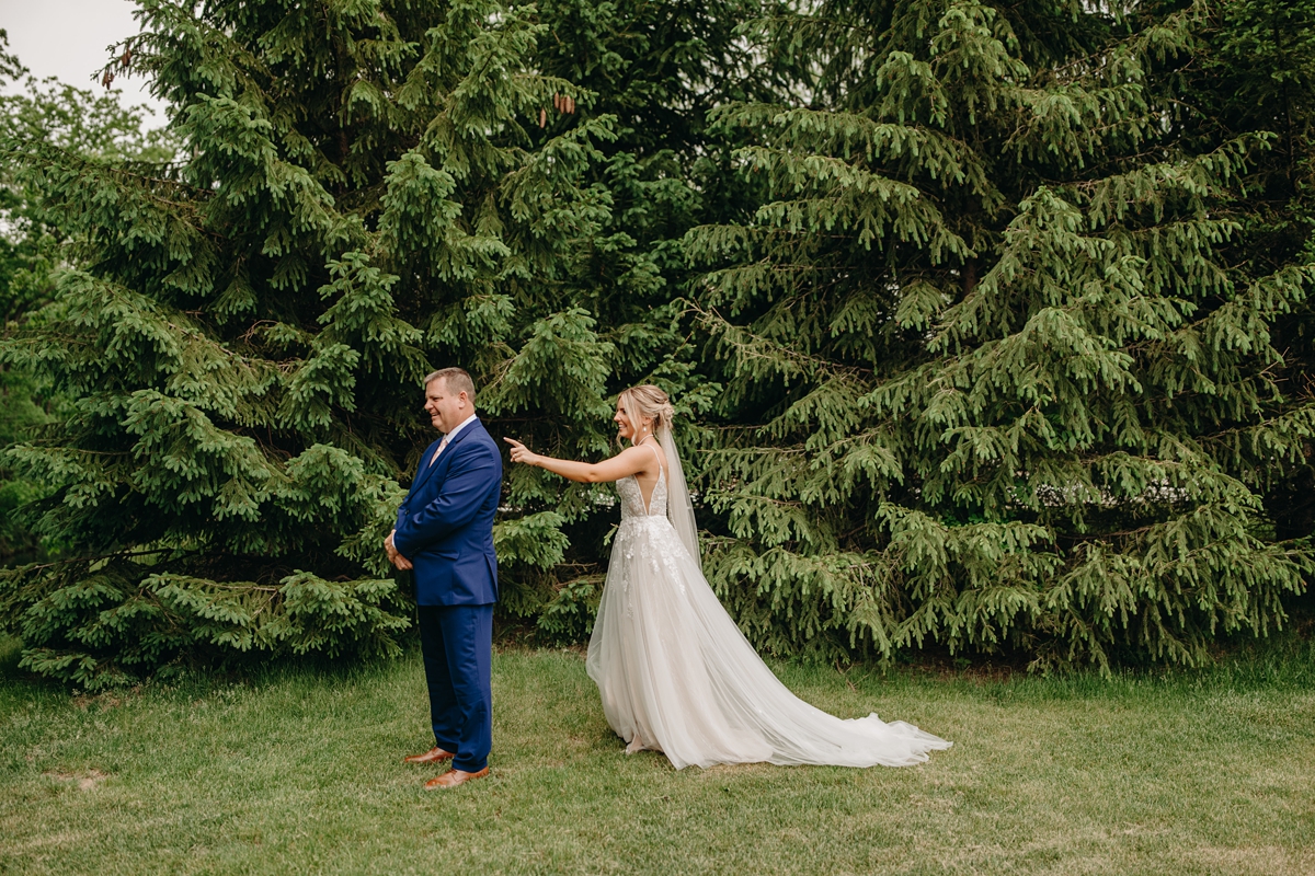 Bride and father's first look at The Celebration Farm in Iowa City, IA