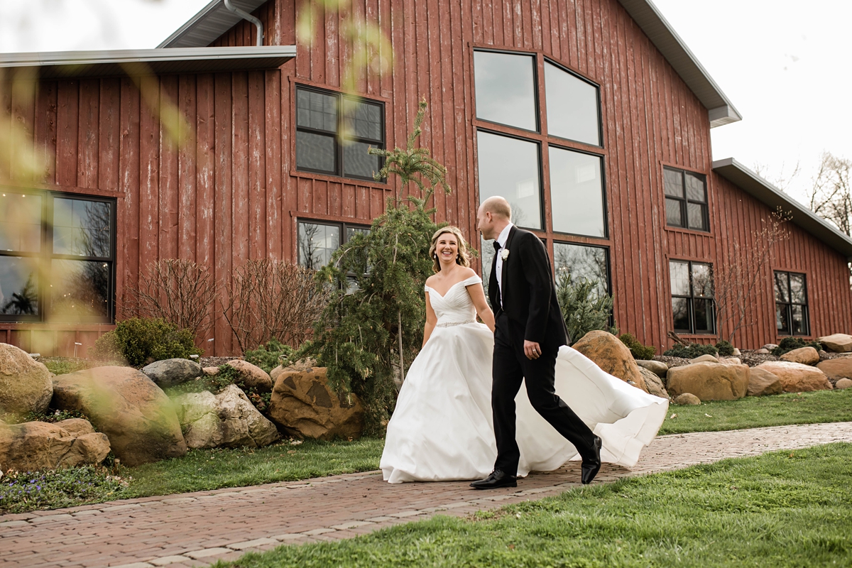 Bride and groom at the red barn at Hornbaker gardens.