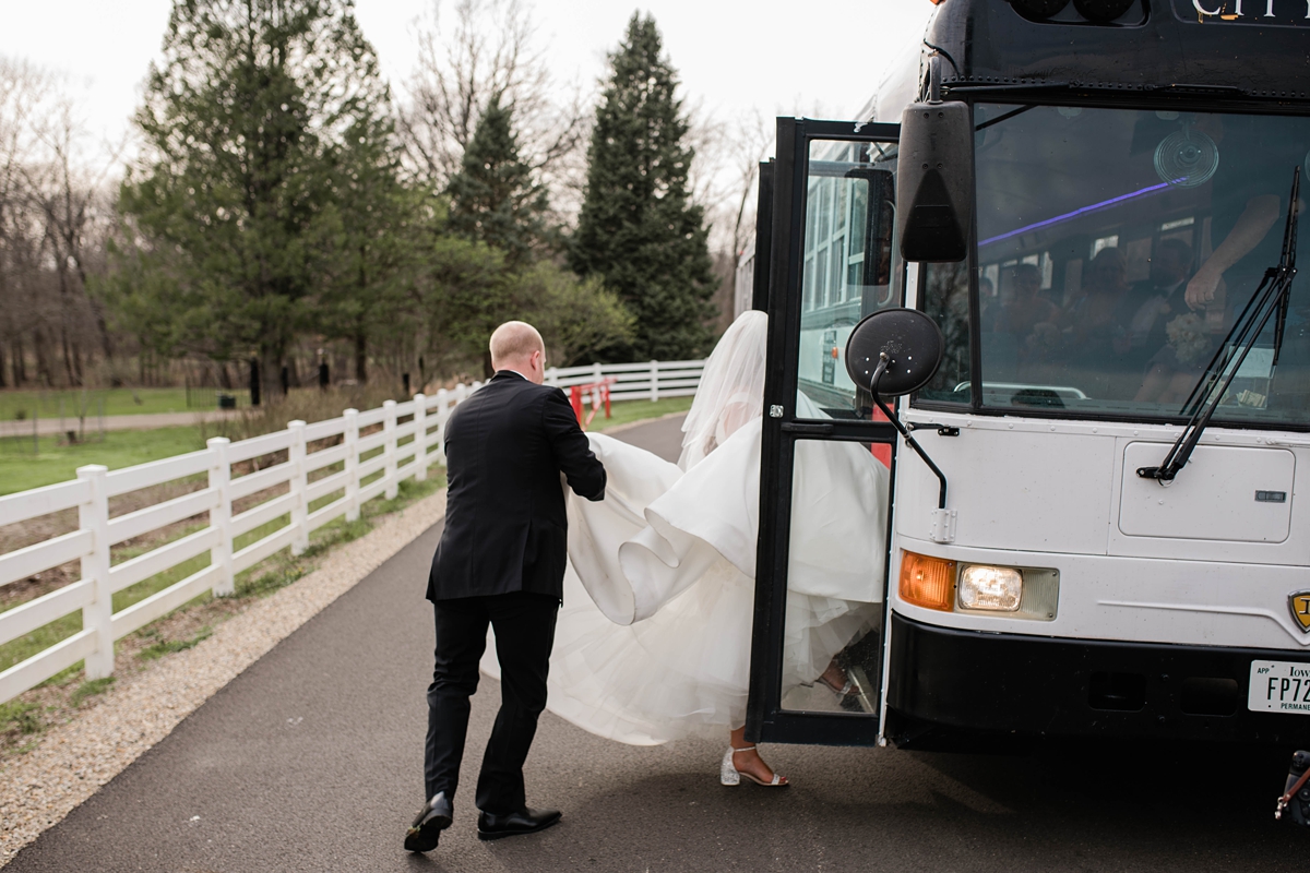 Bride and groom leaving ceremony on bus