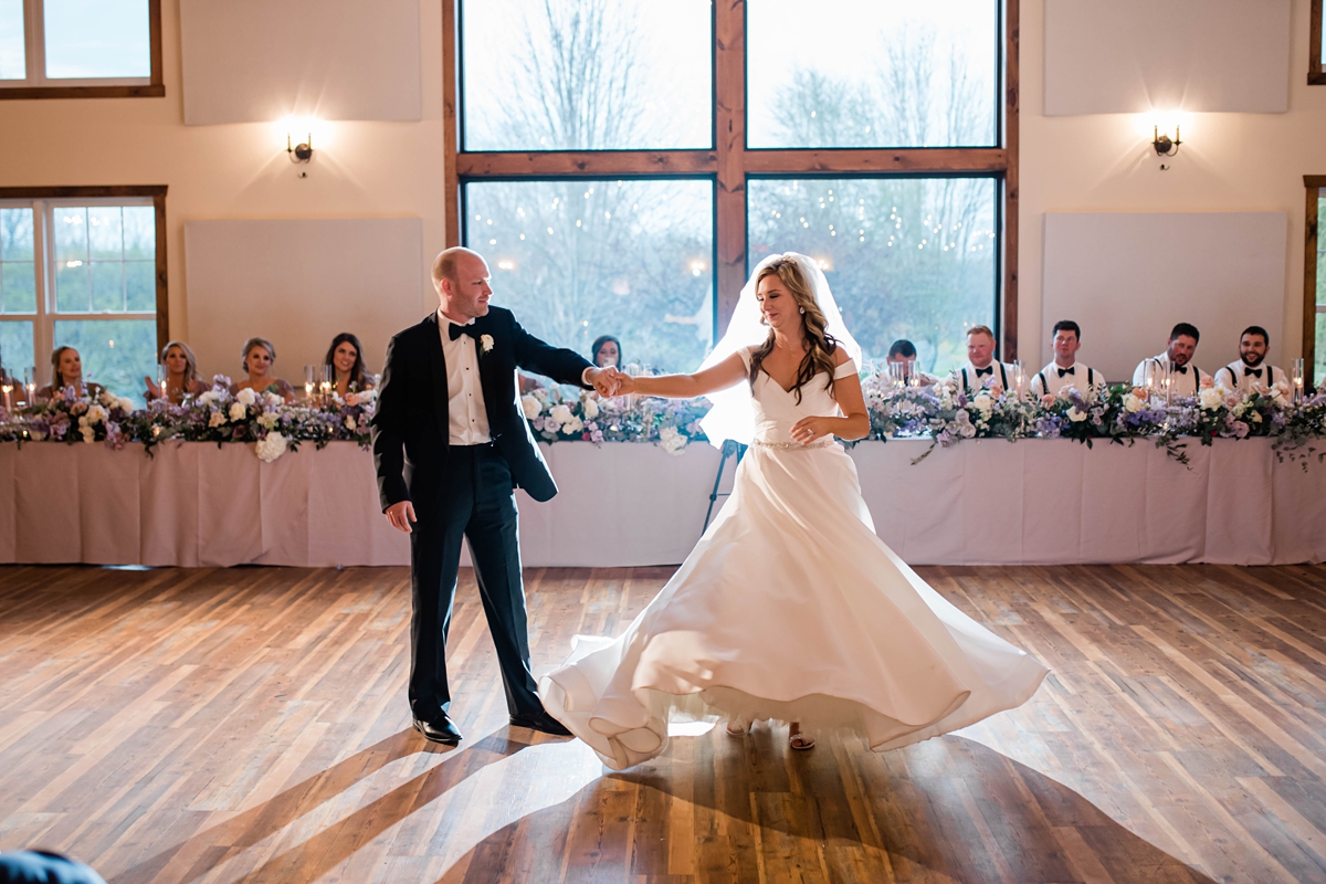 Bride and grooms first dance with twirl