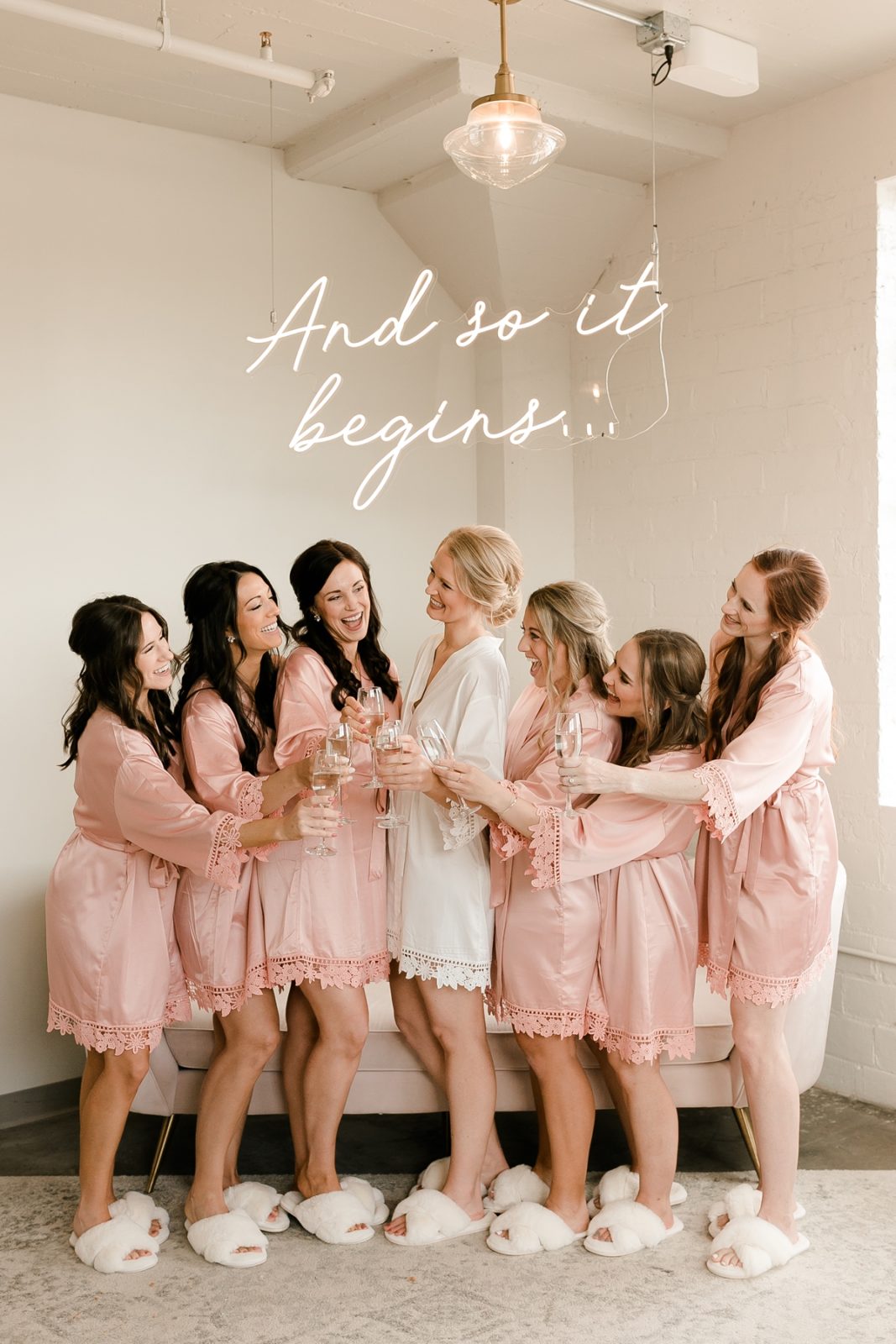 Cedar Rapids Iowa Blush Pink Harmac Wedding bridemaids under custom neon sign with champagne