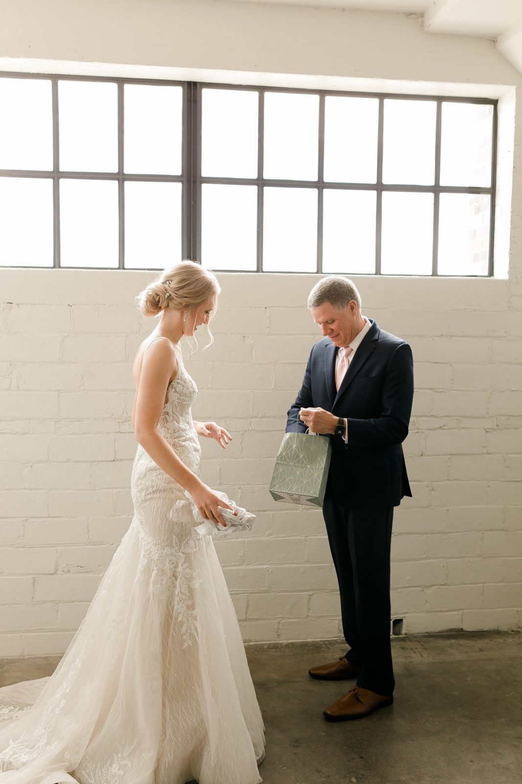 Cedar Rapids Iowa Blush Pink Harmac Wedding bride gives a gift to father before wedding