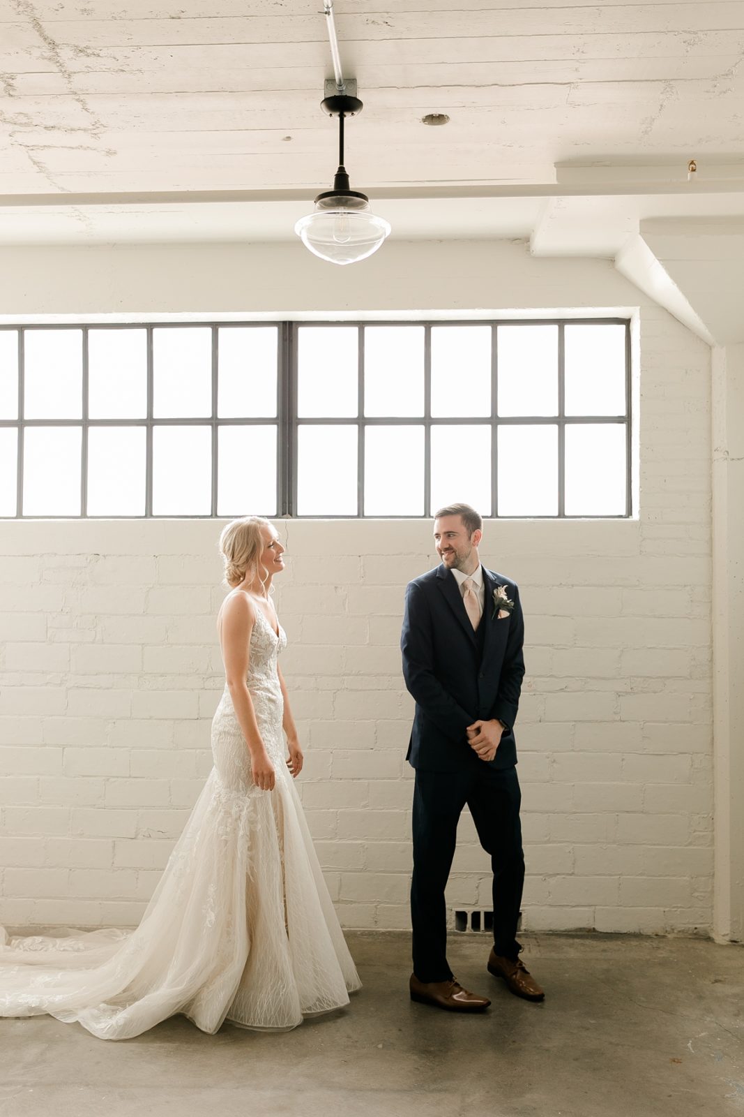 Cedar Rapids Iowa Blush Pink Harmac Wedding bride and groom first look