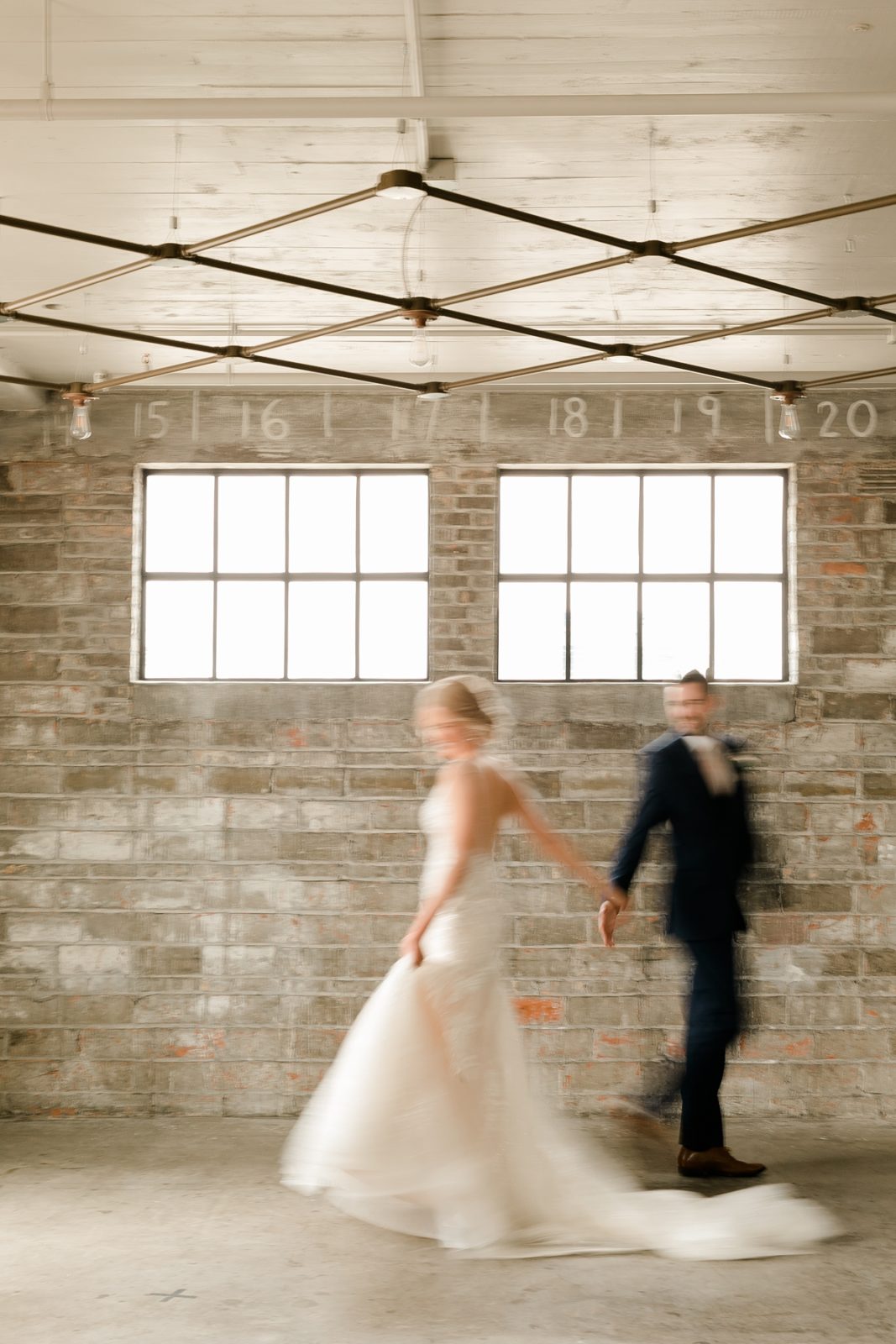 Cedar Rapids Iowa Blush Pink Harmac Wedding bride and groom dancing blurred