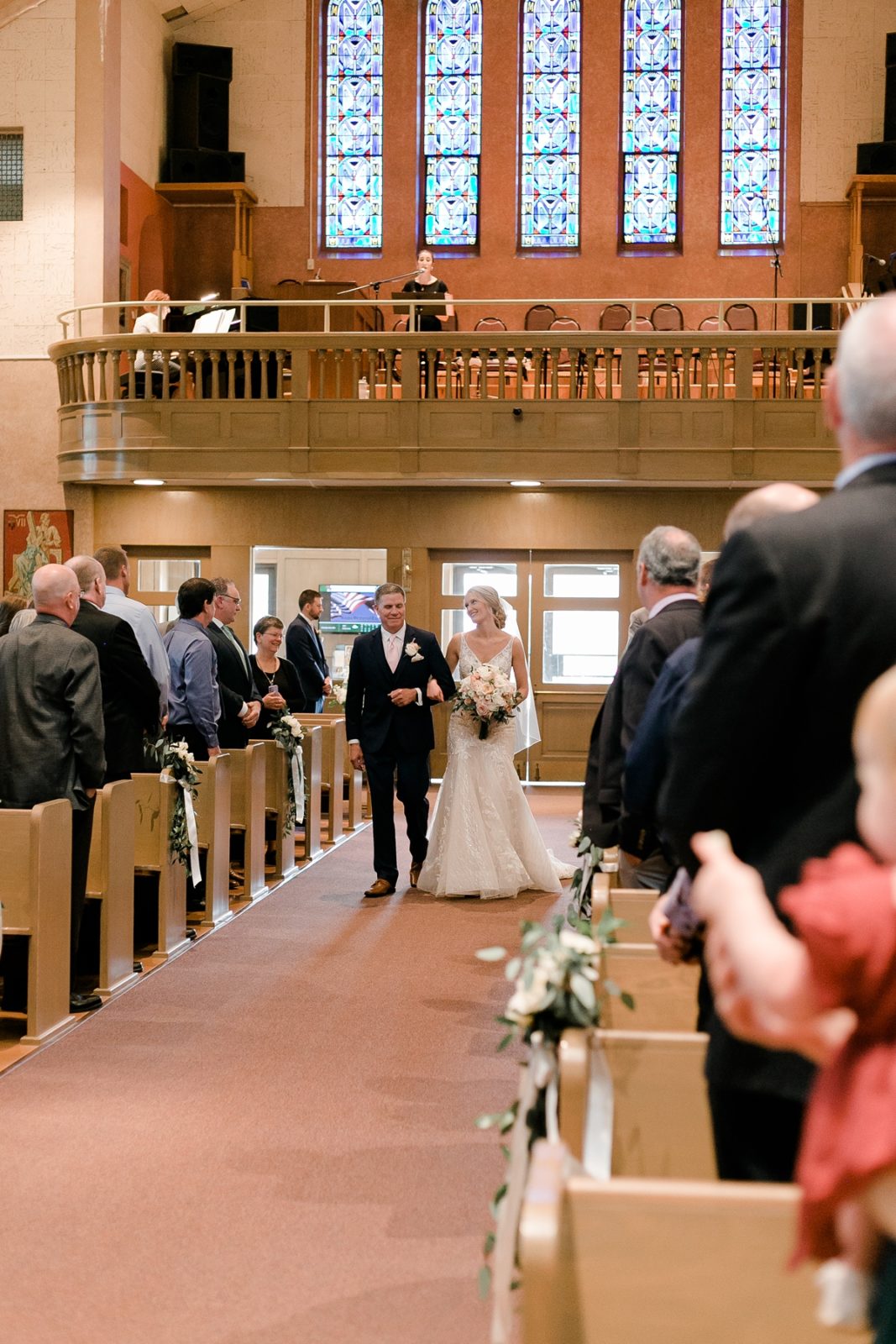 St Patricks Catholic Church In Cedar Rapids Wedding bride and her father walk down aisle