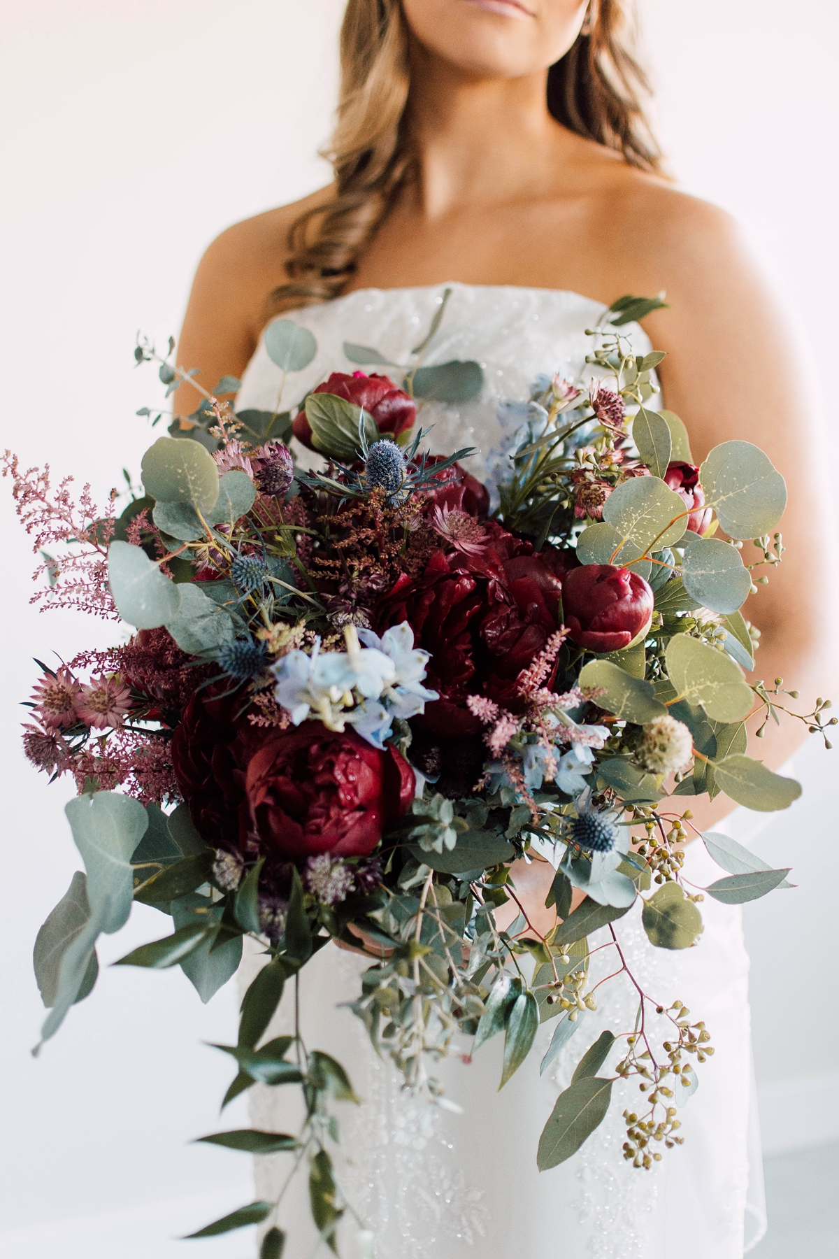 Gathering Barn Williamsburg Iowa Wedding red, blue, and pink bridal bouquet