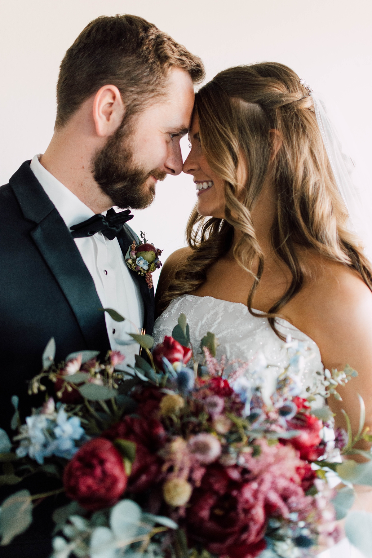 Gathering Barn Williamsburg Iowa Wedding Bride and groom portrait with bouquet