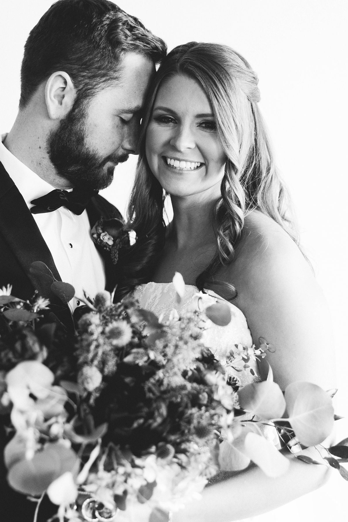 Gathering Barn Williamsburg Iowa Wedding bride and groom black and white happy portrait