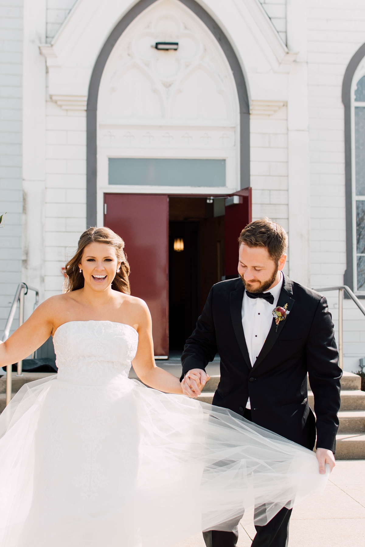 St Peter's Catholic Church in Oxford Iowa bride and groom leaving the front of the church