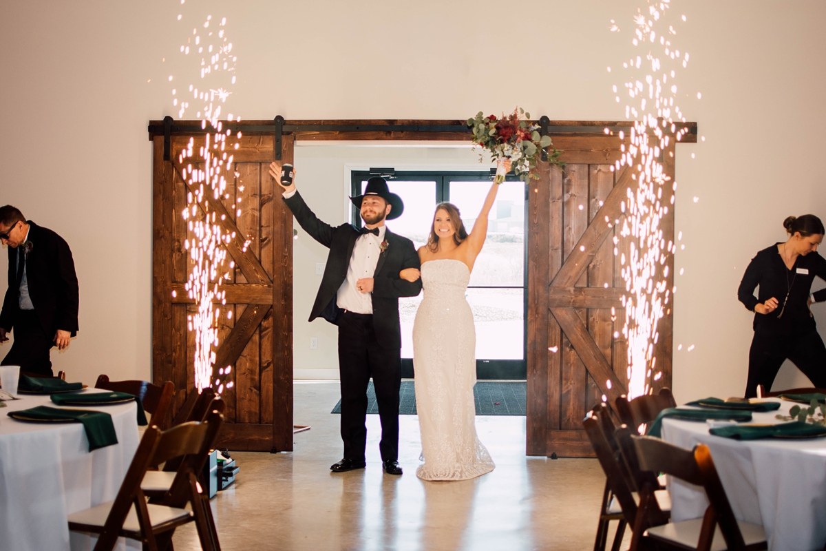 Gathering Barn Williamsburg Iowa Wedding bride and groom entering reception with fireworks