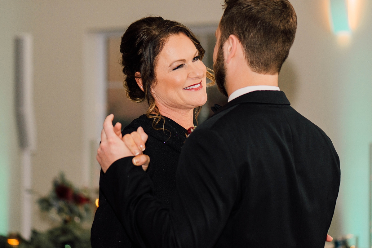 Gathering Barn Williamsburg Iowa Wedding groom dancing with mother