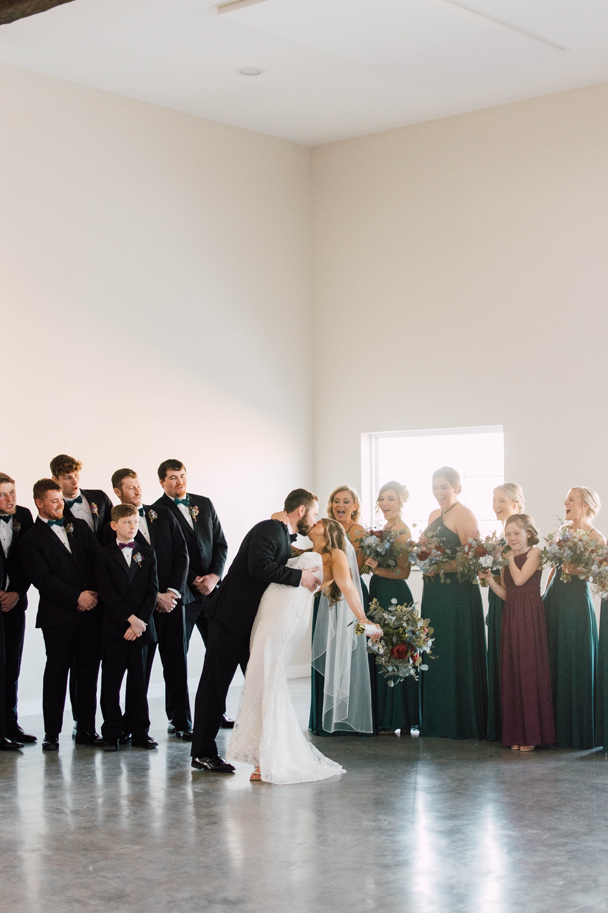 Gathering Barn Williamsburg Iowa Wedding bridal party with jewel tones