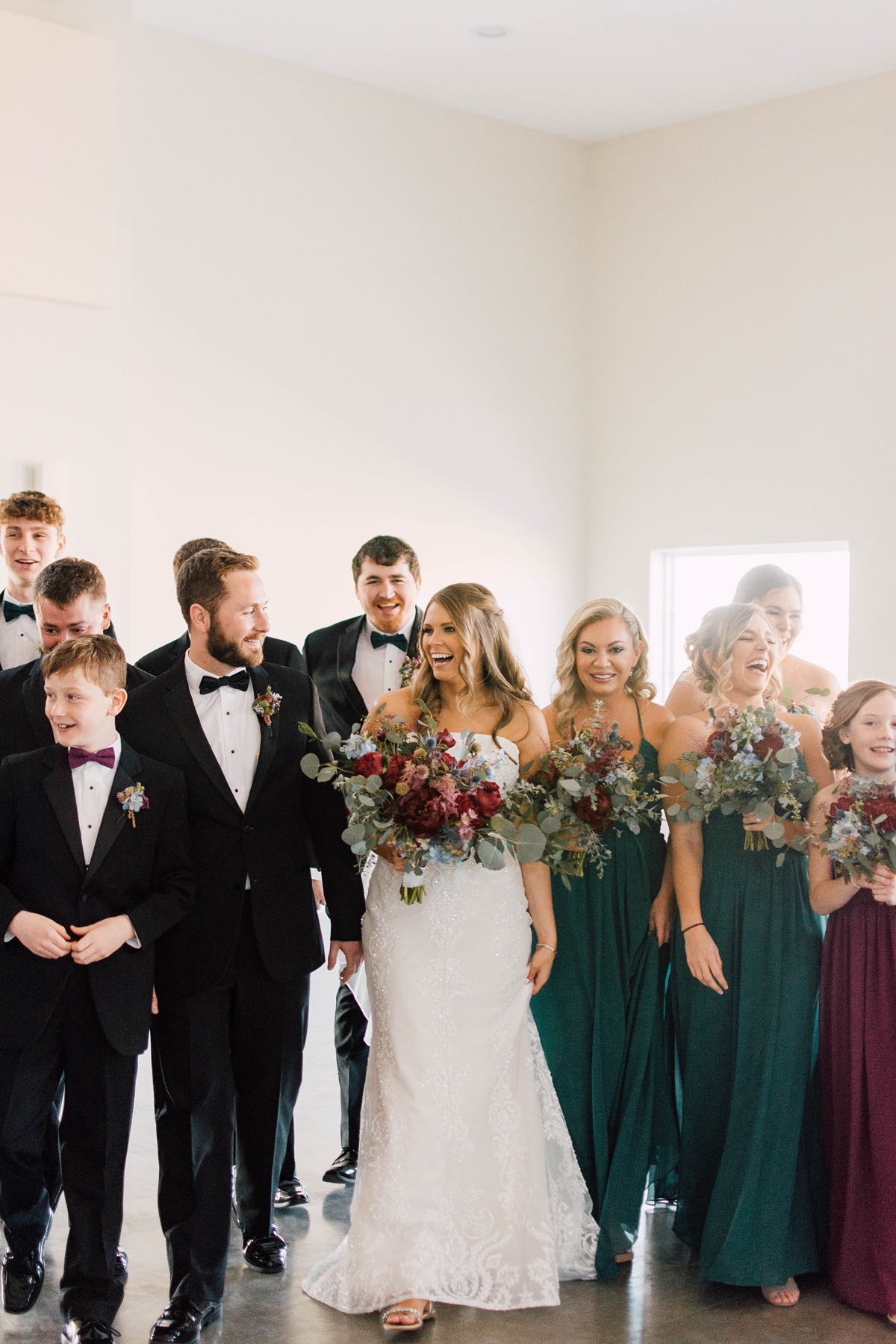 Gathering Barn Williamsburg Iowa Wedding forest green jewel tones and black tuxes bridal party