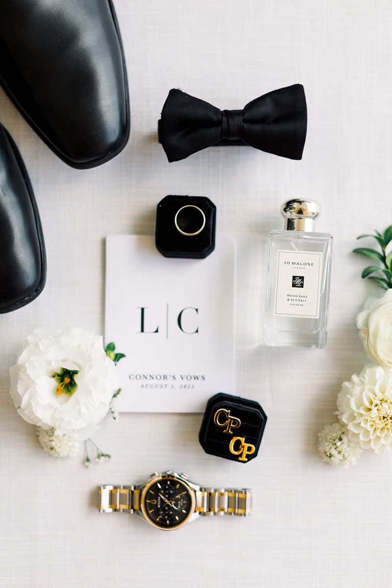 groom detail pictures with ring cologne cufflinks and watch