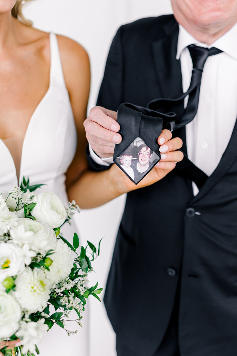 bride with her dad and custom tie with picture