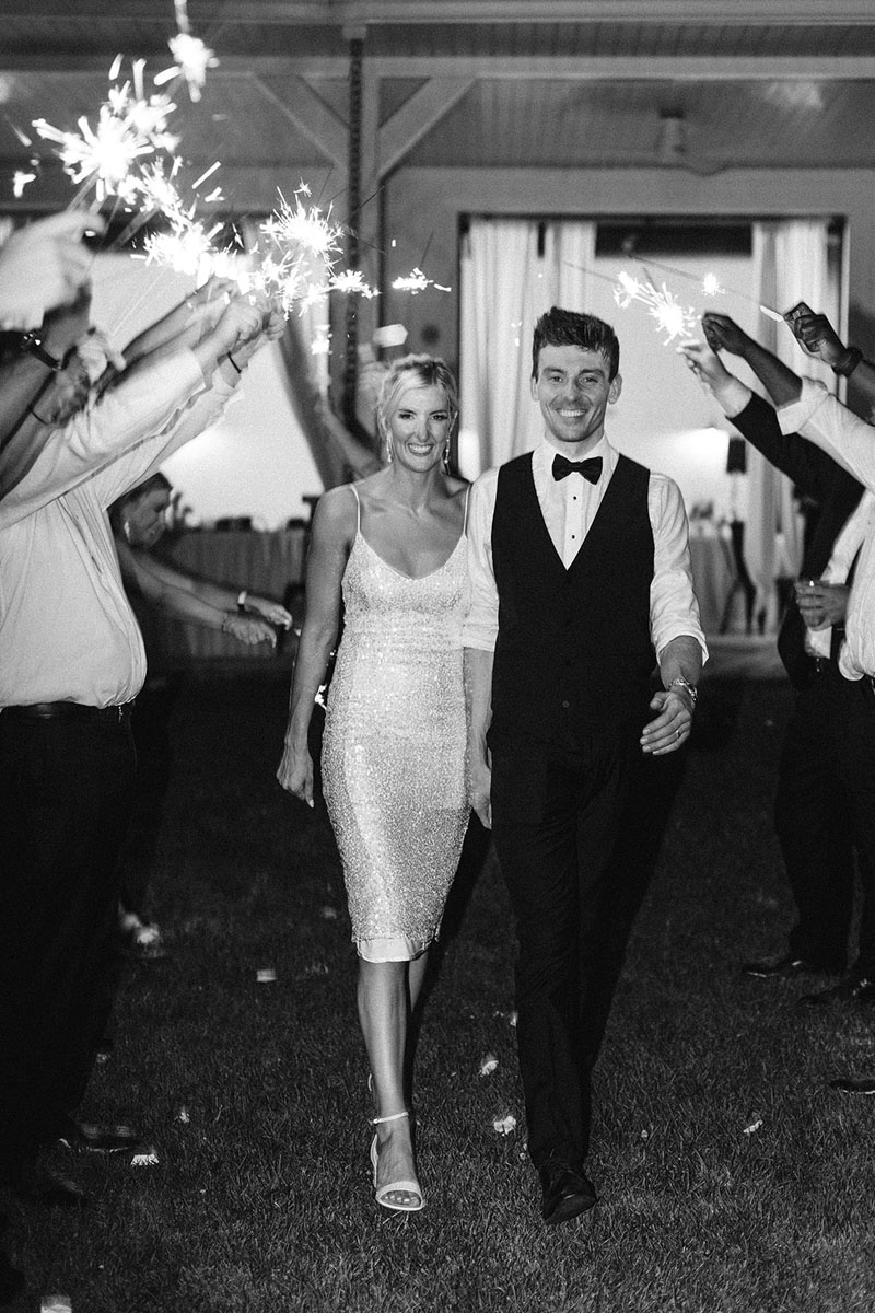 Bride & Groom smiling during Sparkler exit