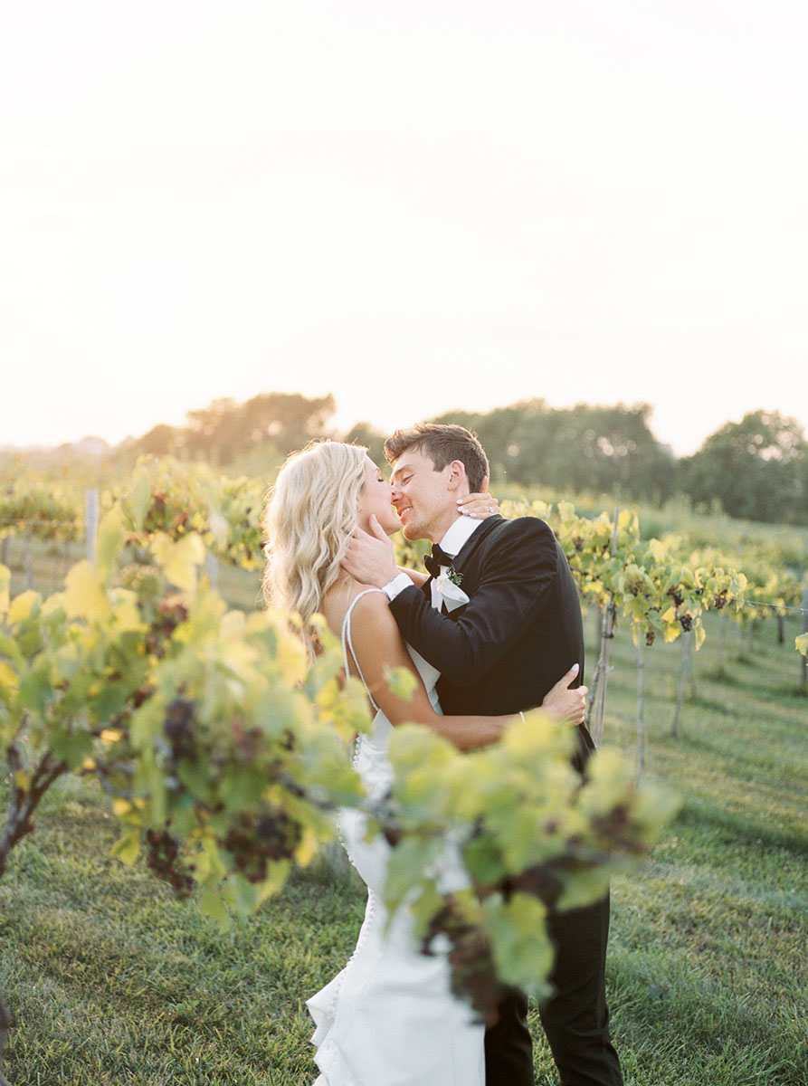 bride and groom in vineyard walker homestead
